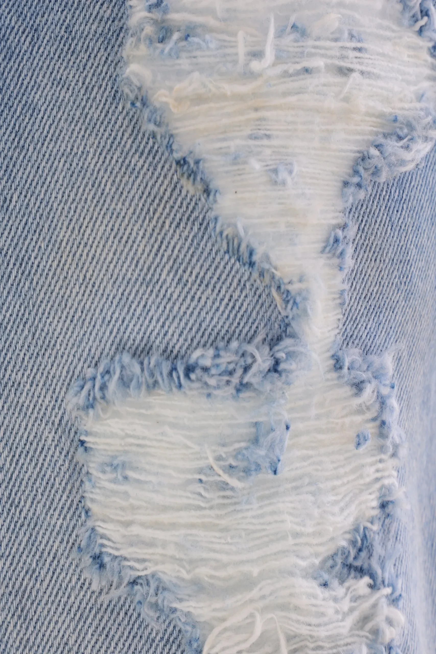 Women MM6 denim vest with a distressed effect