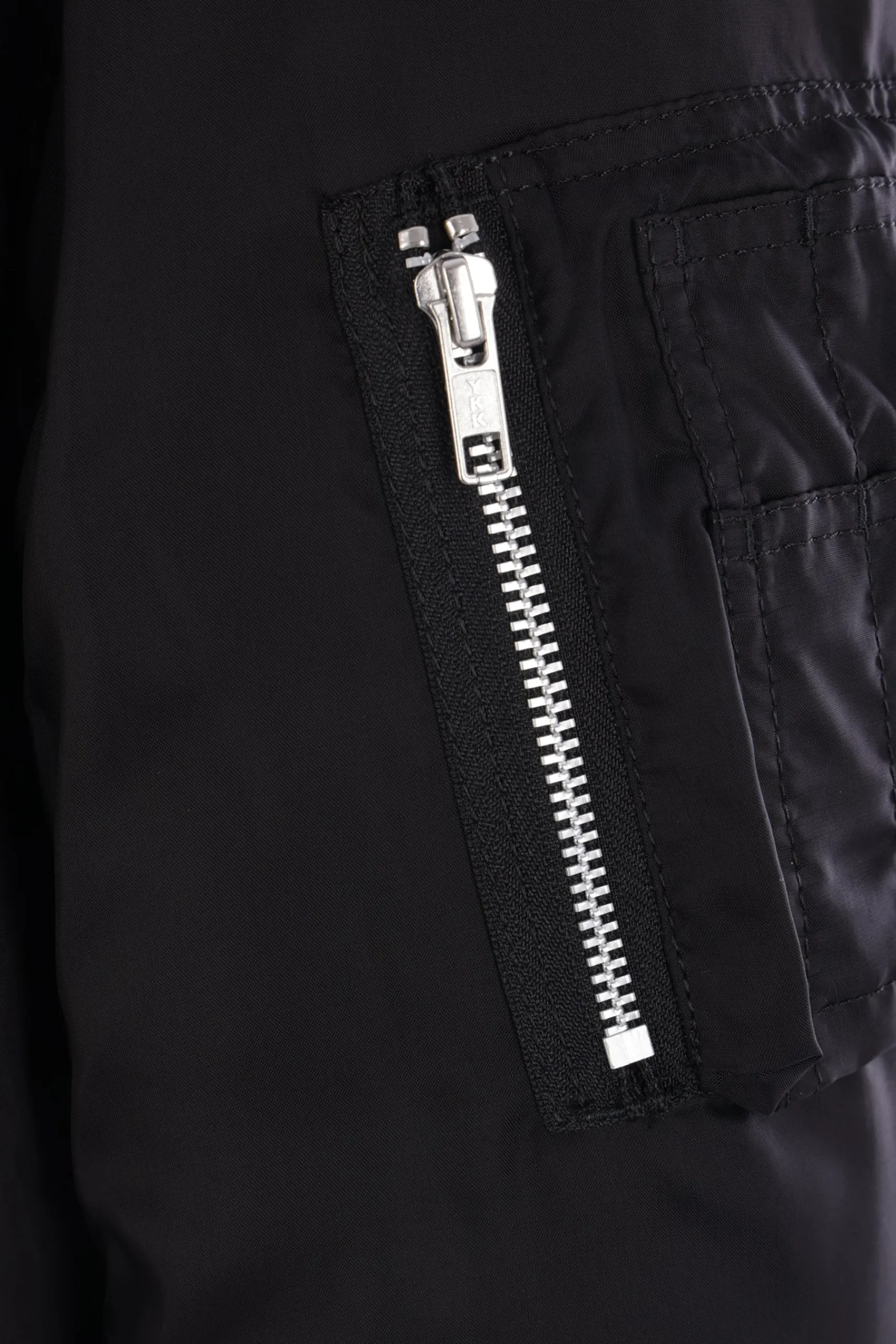 BLACK COMME des GARÇONS reversible asymmetrical bomber jacket.